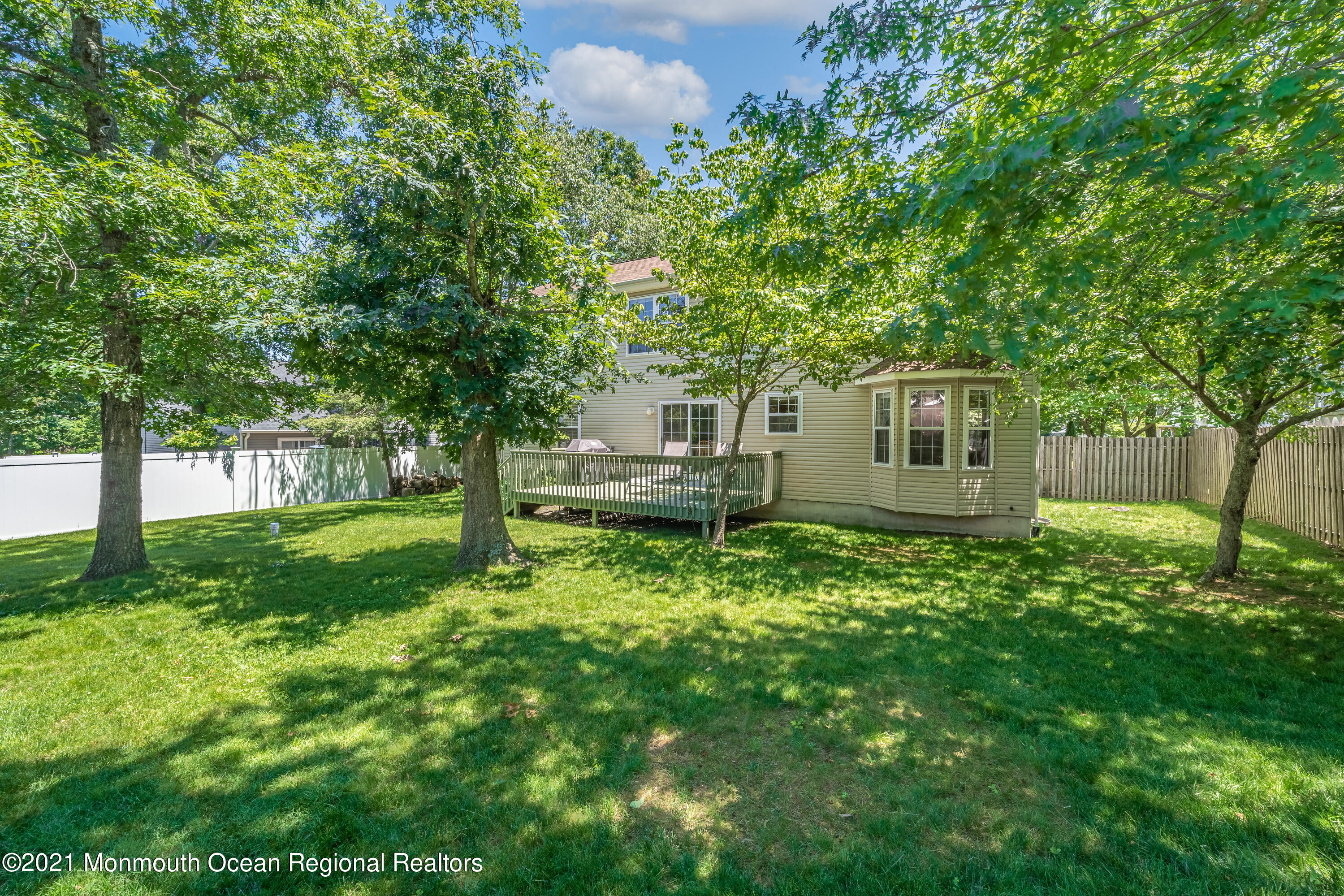 217 Topside Road Manahawkin, NJ 08050 - Photo 29 of 35 a backyard of a house with table and chairs