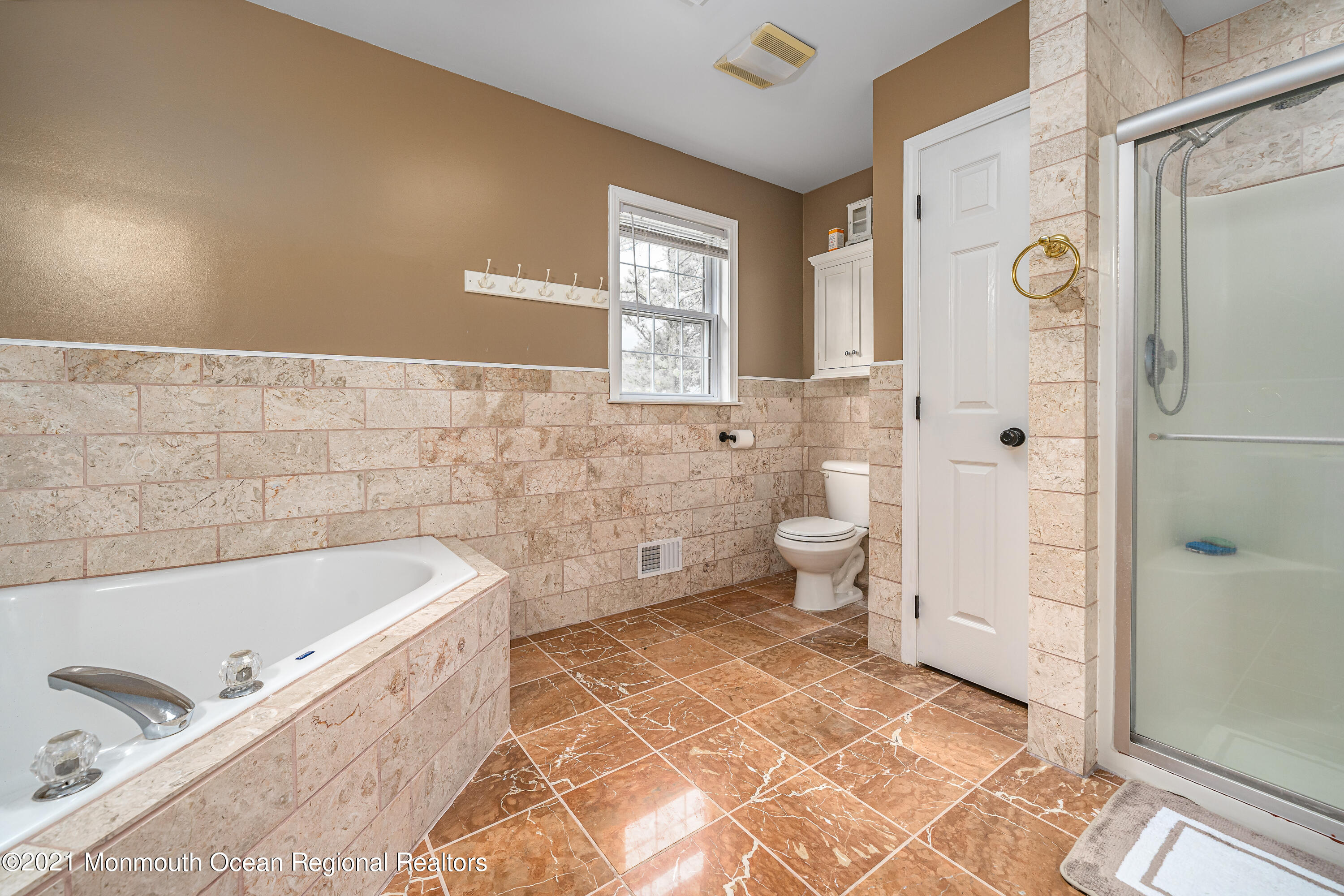 217 Topside Road Manahawkin, NJ 08050 - Photo 30 of 35 a bathroom with a bathtub and toilet