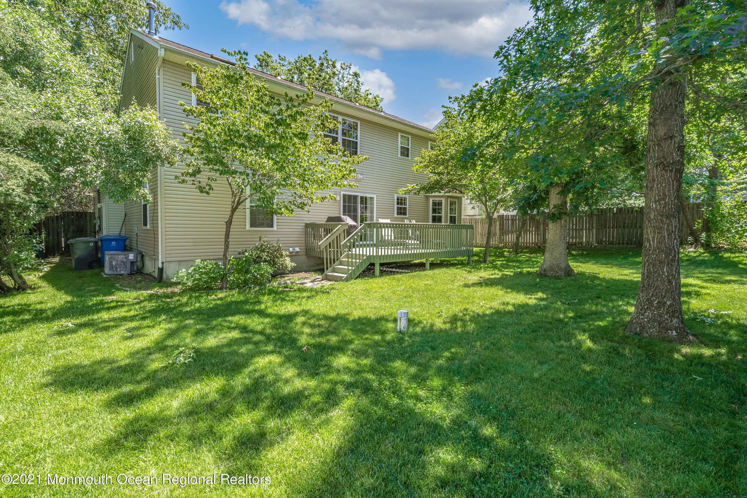 217 Topside Road Manahawkin, NJ 08050 - Photo 31 of 35 a view of a house with a yard and sitting area