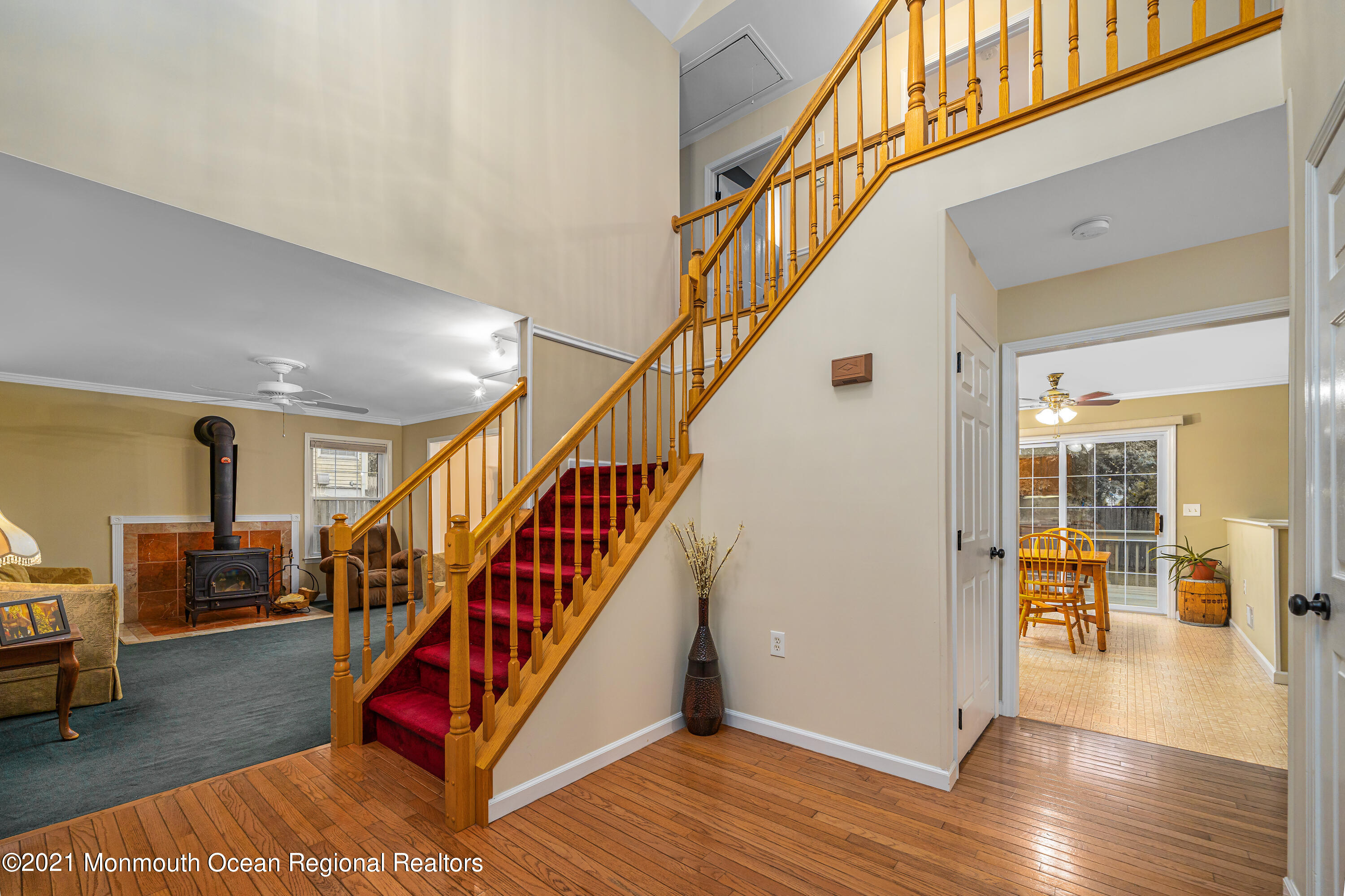217 Topside Road Manahawkin, NJ 08050 - Photo 5 of 35 a view of entryway dining room and hall with wooden floor