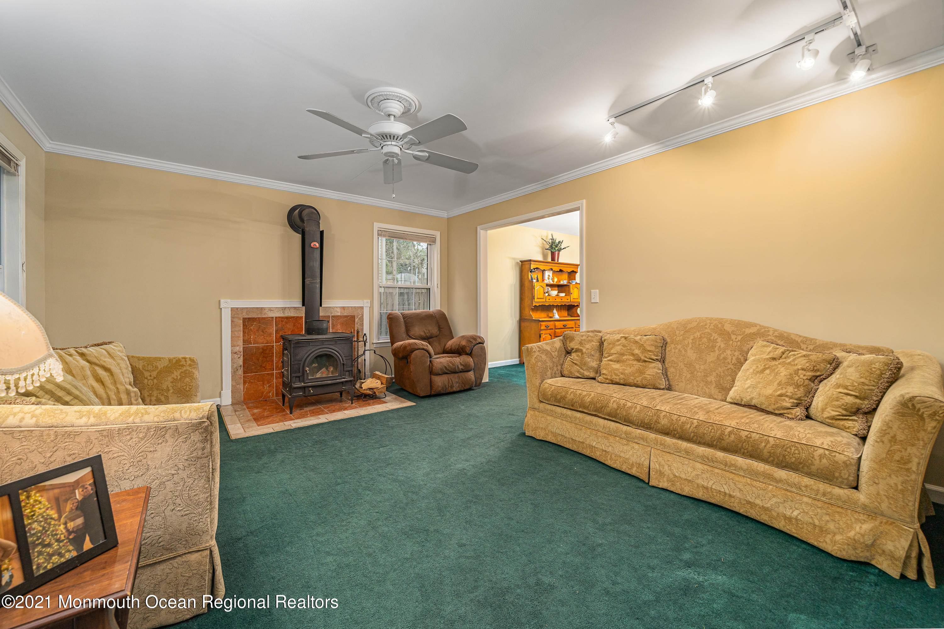 217 Topside Road Manahawkin, NJ 08050 - Photo 6 of 35 a living room with furniture and a chandelier