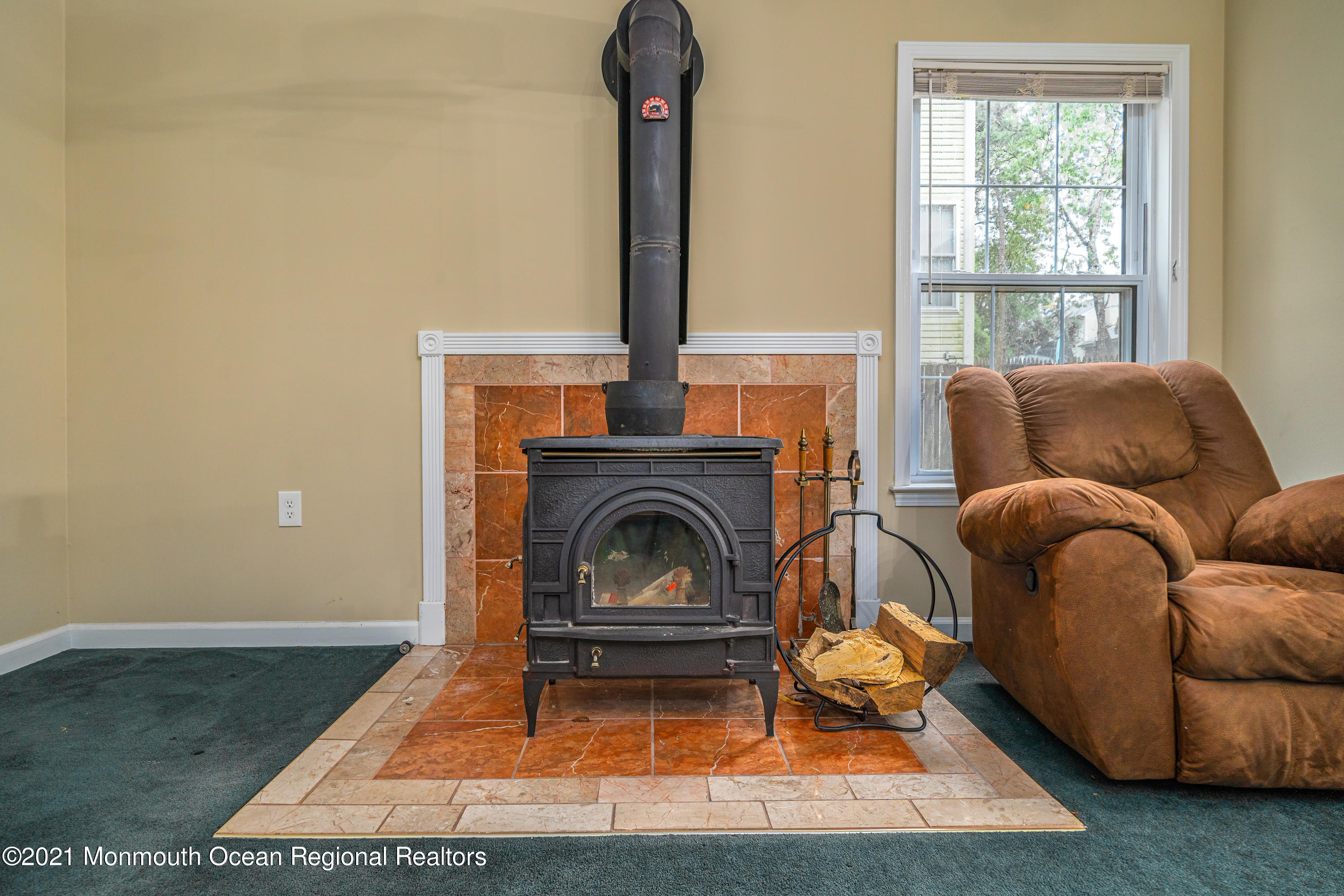 217 Topside Road Manahawkin, NJ 08050 - Photo 7 of 35 a living room with furniture and a fireplace