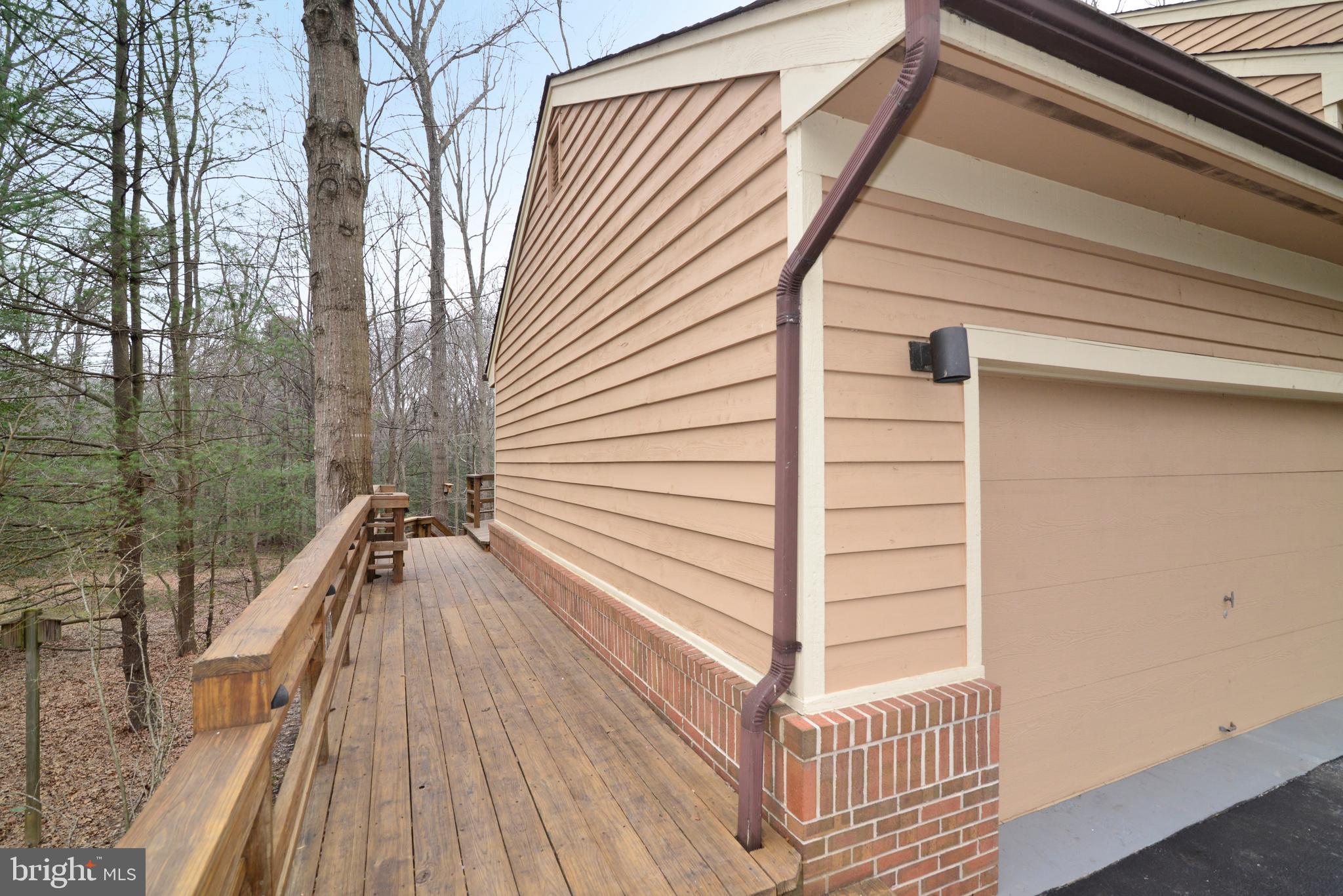 11410 Fieldstone Lane Reston, VA 20191 - Photo 21 of 50 a view of a balcony with wooden floor and fence