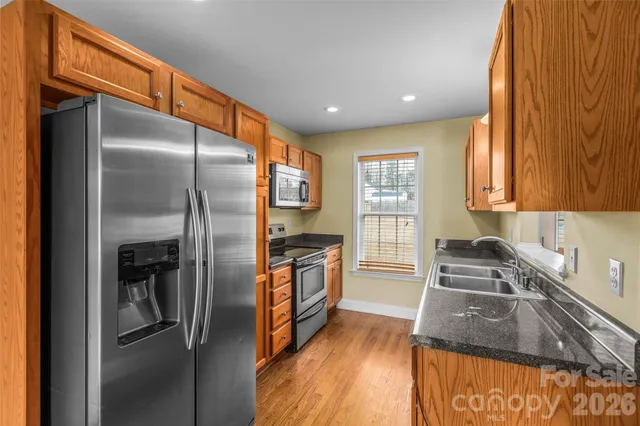a kitchen that has a sink and a stove