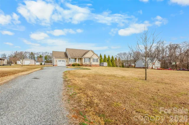 a view of road with residential houses
