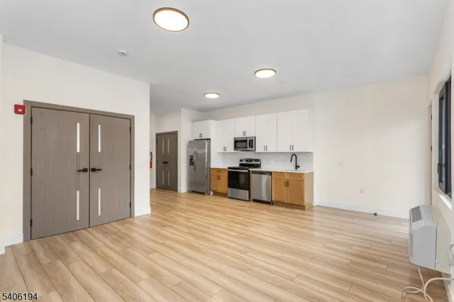 a view of kitchen with wooden floor