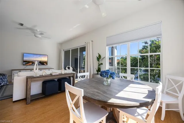 a view of a dining room with furniture window and outside view