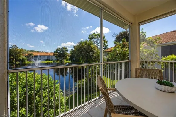 a view of balcony with furniture