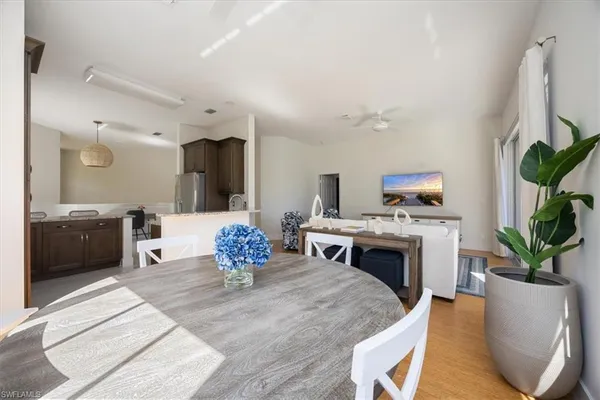 a living room with furniture a fireplace and a potted plant