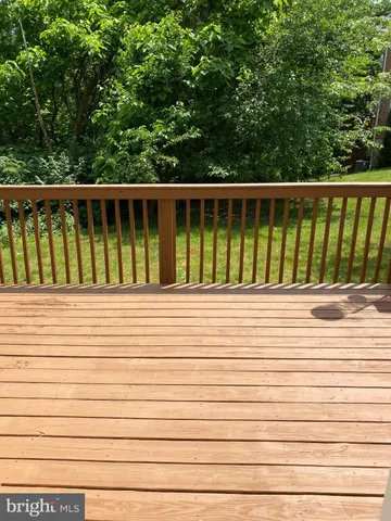 a balcony with wooden floor