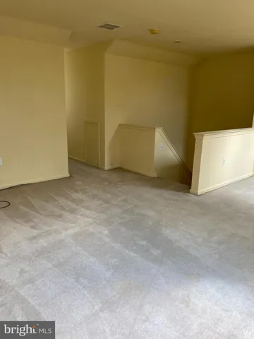 a white stove top oven sitting inside of a kitchen