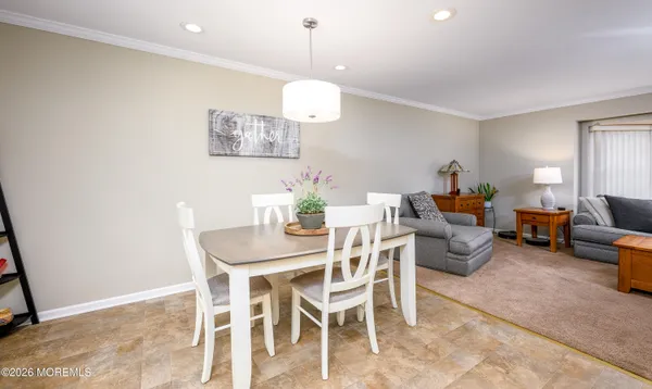 a kitchen with a table and chairs in it