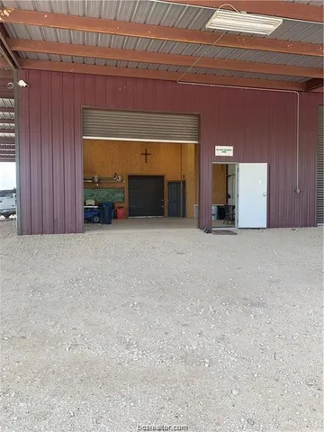 a view of an empty room with a fireplace