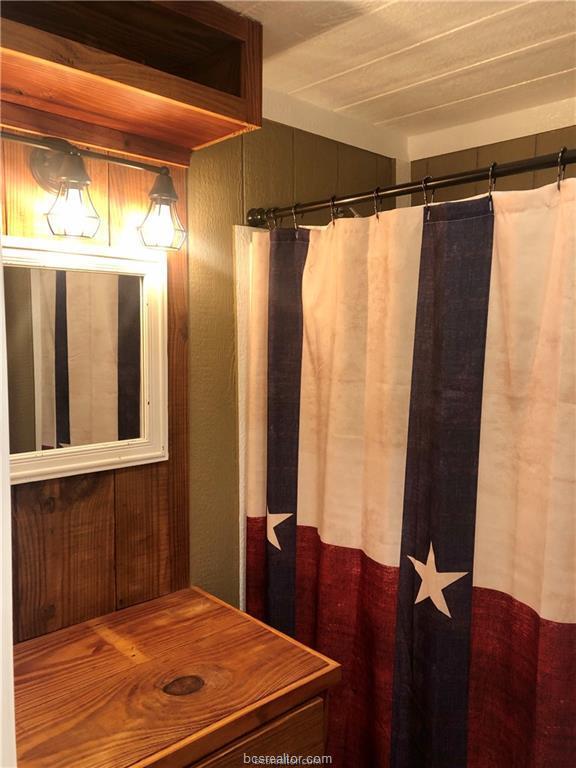 11351 Oak Lake Road Bryan, TX 77808 - Photo 6 of 20 a bedroom with a bed and a window