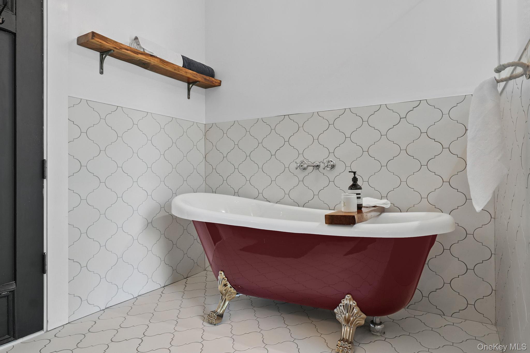 3 Holbrook Road Briarcliff Manor, NY 10510 - Photo 24 of 38 Primary Bathroom featuring a freestanding tub and light tile patterned floors