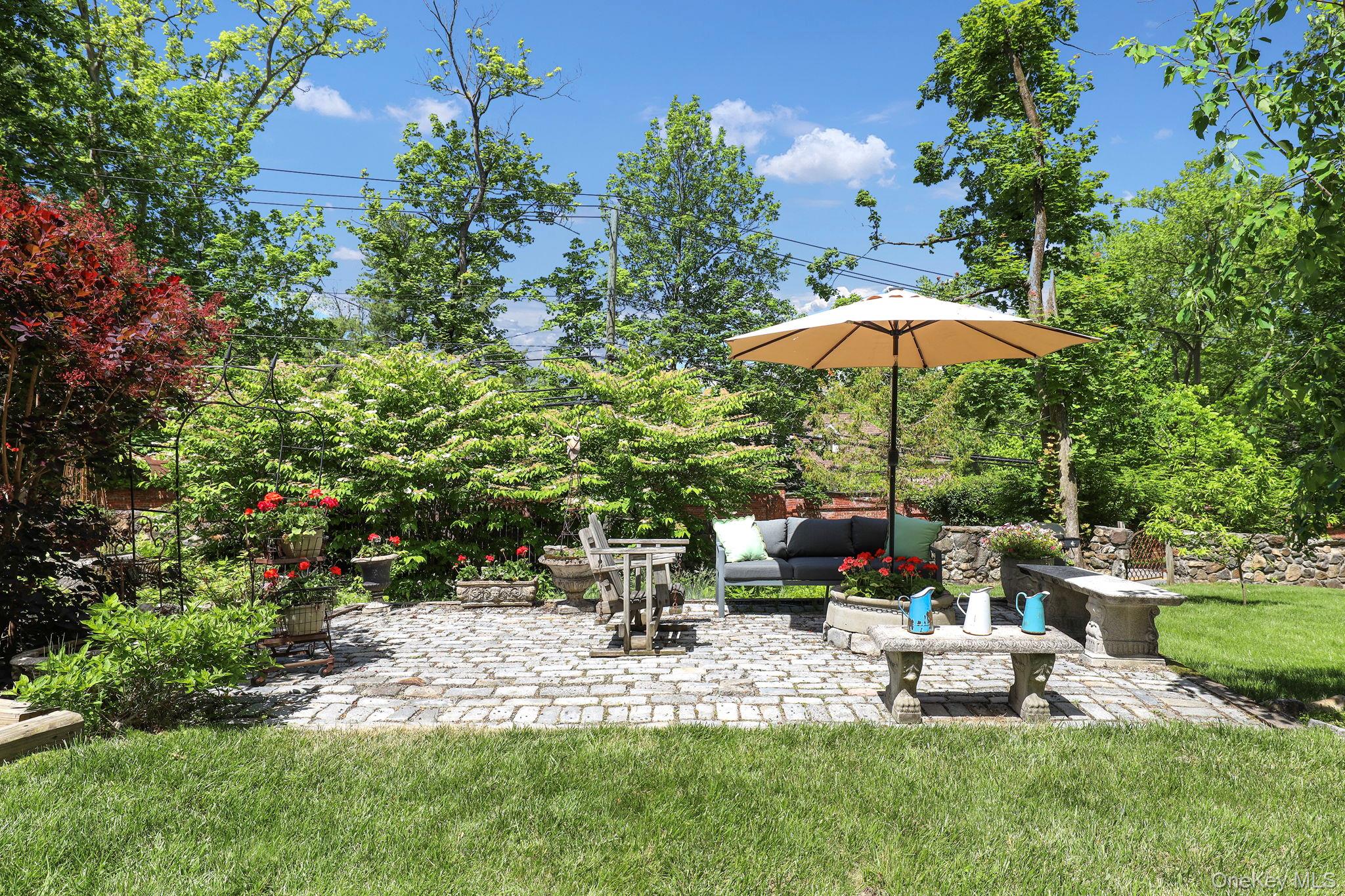 3 Holbrook Road Briarcliff Manor, NY 10510 - Photo 30 of 38 View of patio / terrace featuring an outdoor hangout area and view of gardens and wooded area