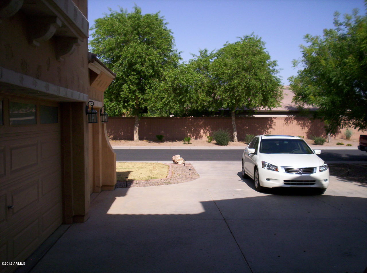 3044 South Martingale Road Gilbert, AZ 85295 - Photo 13 of 20 a car parked on the side of a road