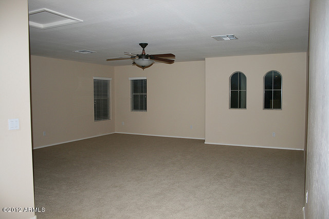 3044 South Martingale Road Gilbert, AZ 85295 - Photo 6 of 20 a view of an empty room with chandelier fan