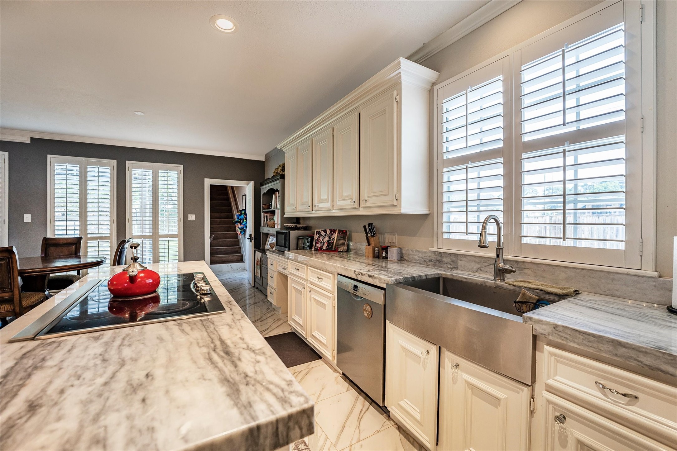 8002 Royal Crest Court Spring, TX 77379 - Photo 17 of 50 a kitchen with granite countertop a sink stove and cabinets