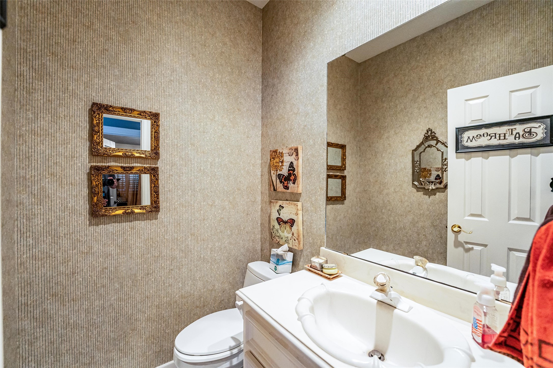 8002 Royal Crest Court Spring, TX 77379 - Photo 18 of 50 a bathroom with a sink vanity mirror and toilet