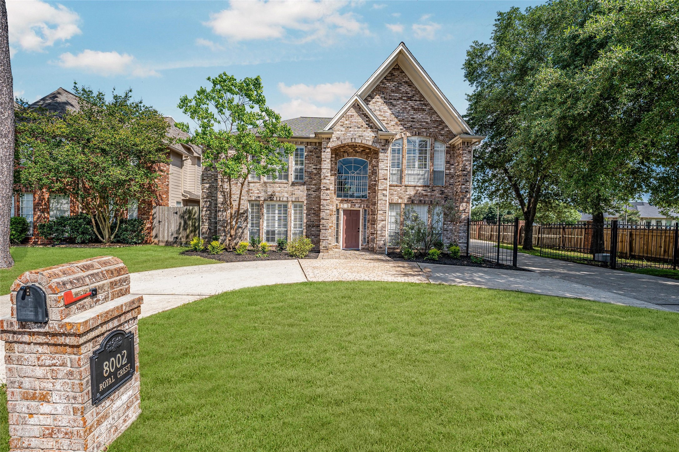 8002 Royal Crest Court Spring, TX 77379 - Photo 2 of 50 a front view of a house with a garden