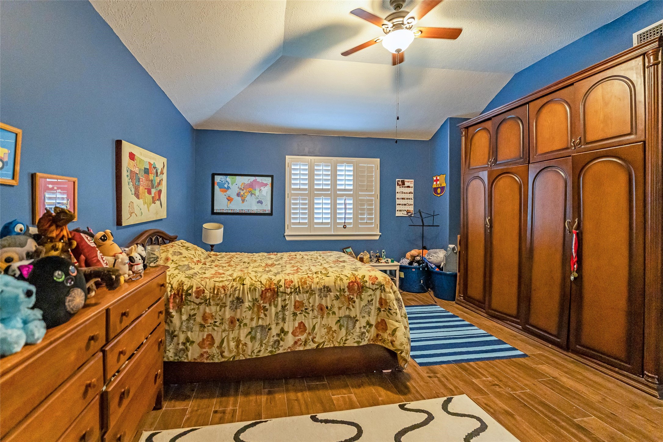 8002 Royal Crest Court Spring, TX 77379 - Photo 25 of 50 a bed sitting in a spacious bedroom next to a window