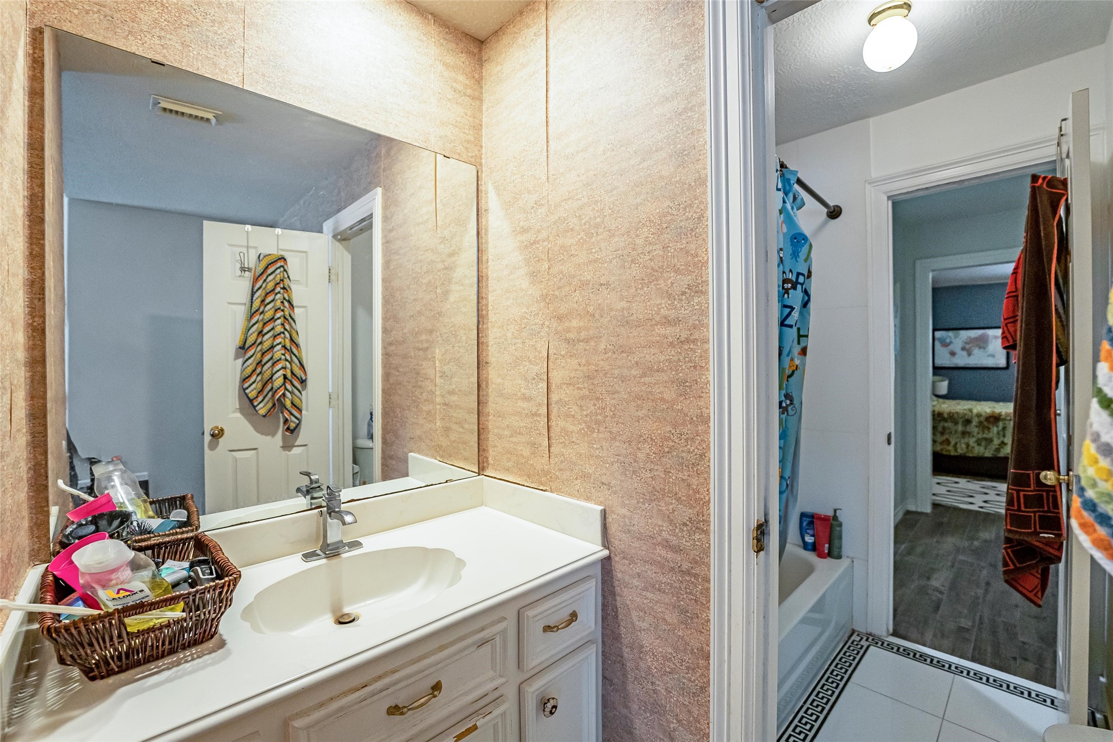 8002 Royal Crest Court Spring, TX 77379 - Photo 30 of 50 a bathroom with a sink and a mirror