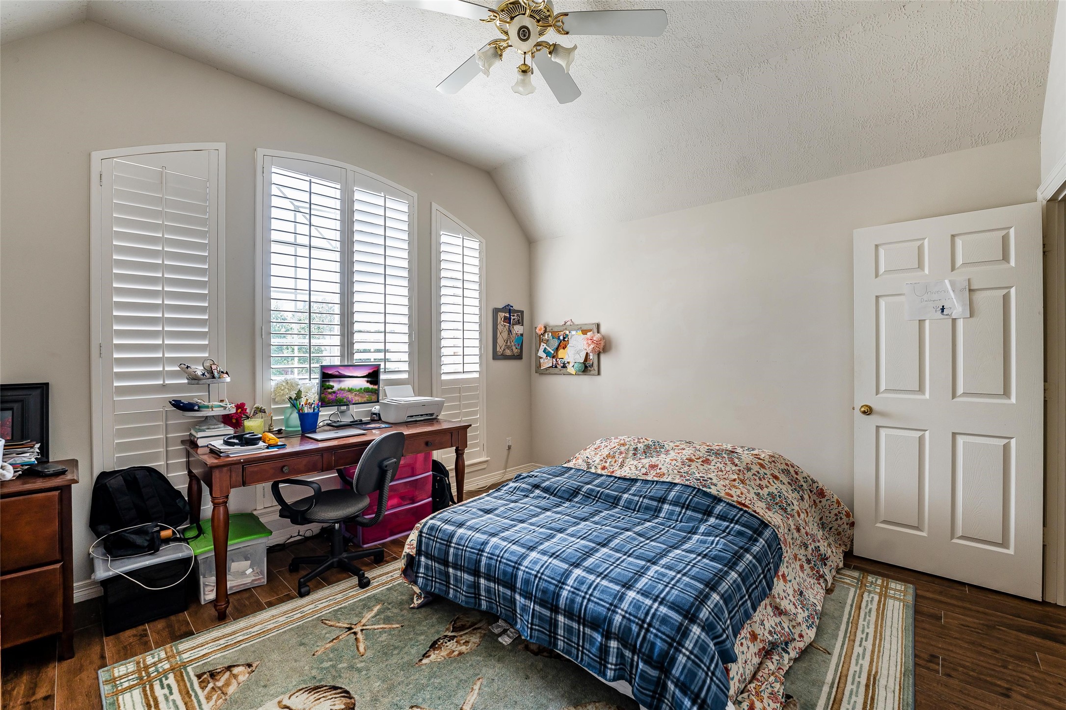 8002 Royal Crest Court Spring, TX 77379 - Photo 33 of 50 a bedroom that has a bed and a table in it