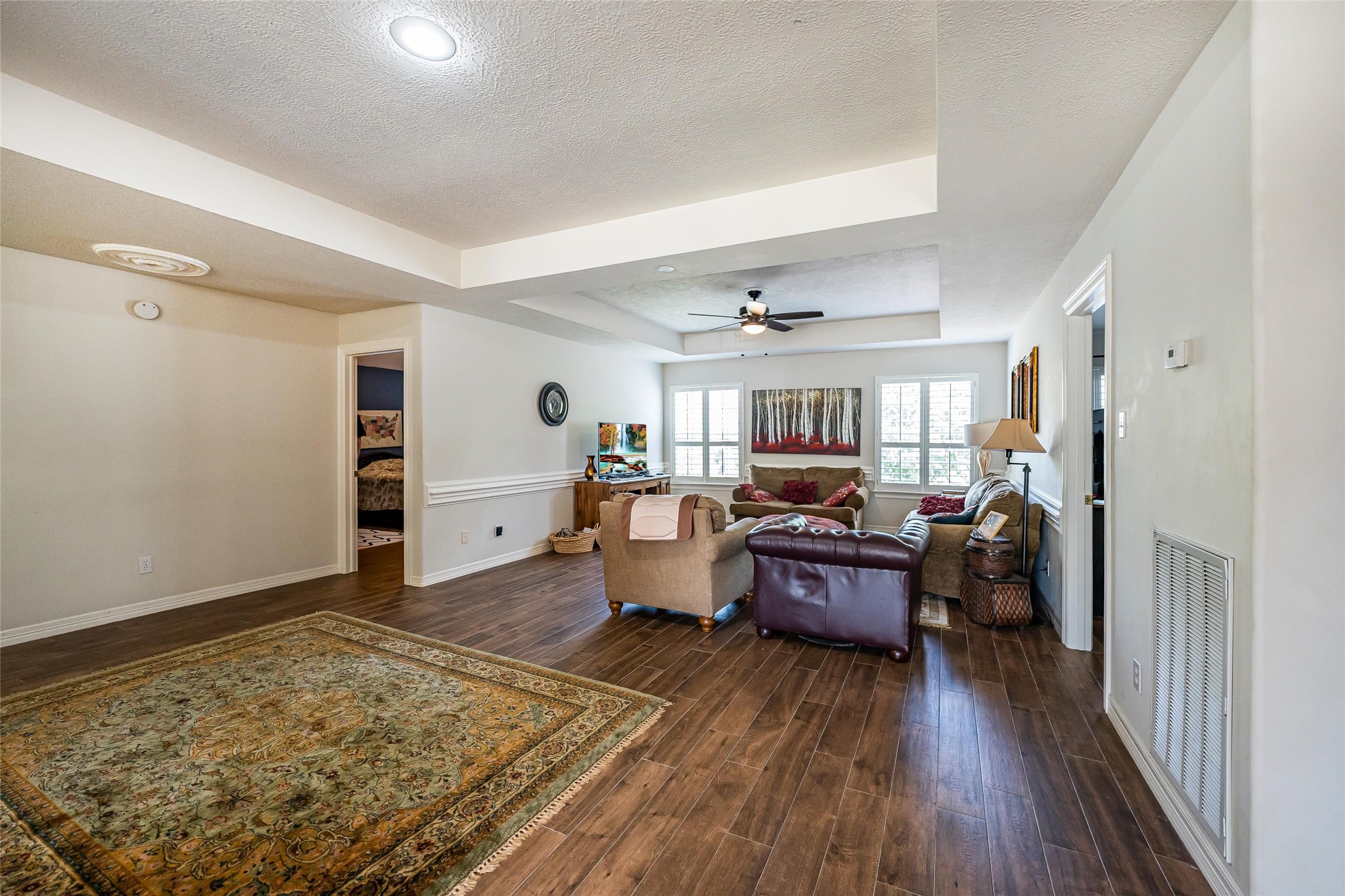8002 Royal Crest Court Spring, TX 77379 - Photo 38 of 50 a living room with furniture and a wooden floor