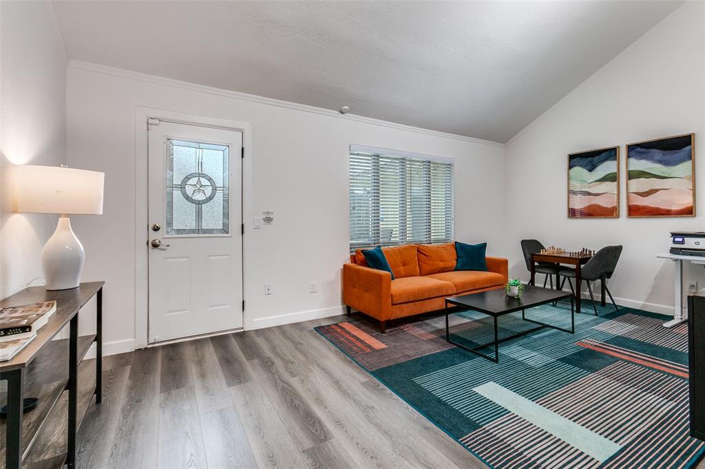 2901 Regal Road Plano, TX 75075 - Photo 10 of 21 a living room with furniture a rug and a window