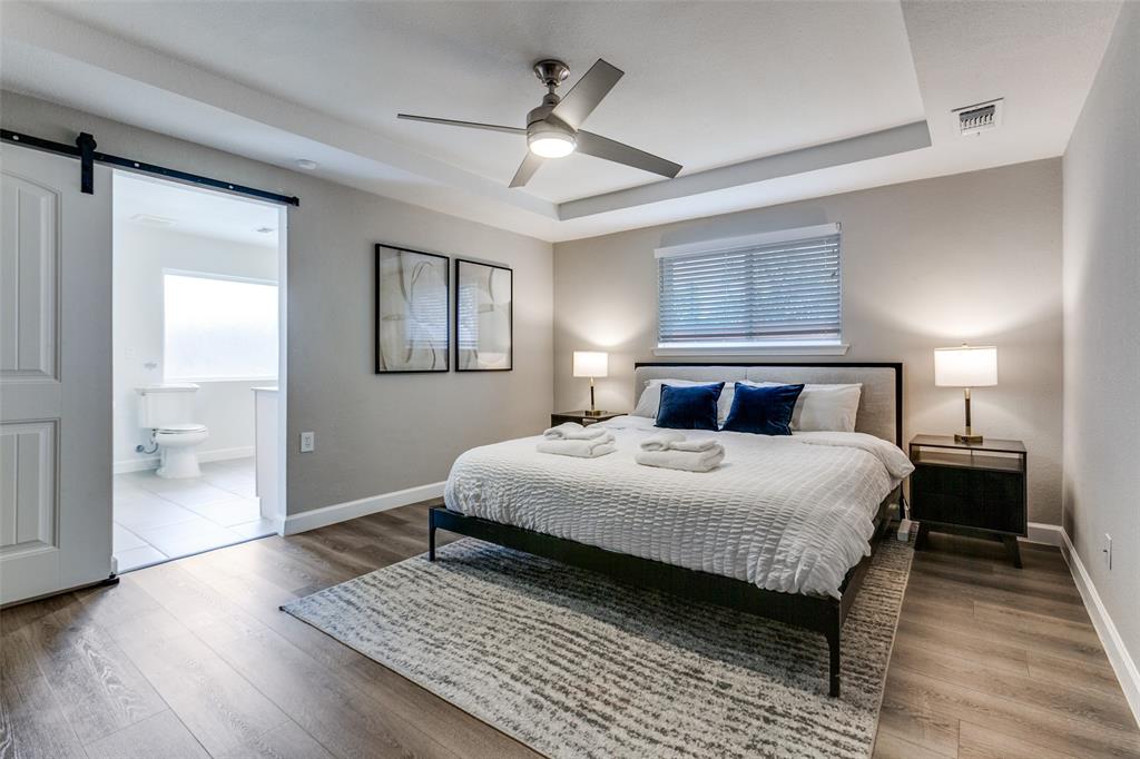 2901 Regal Road Plano, TX 75075 - Photo 12 of 21 a bedroom with bed and wooden floor