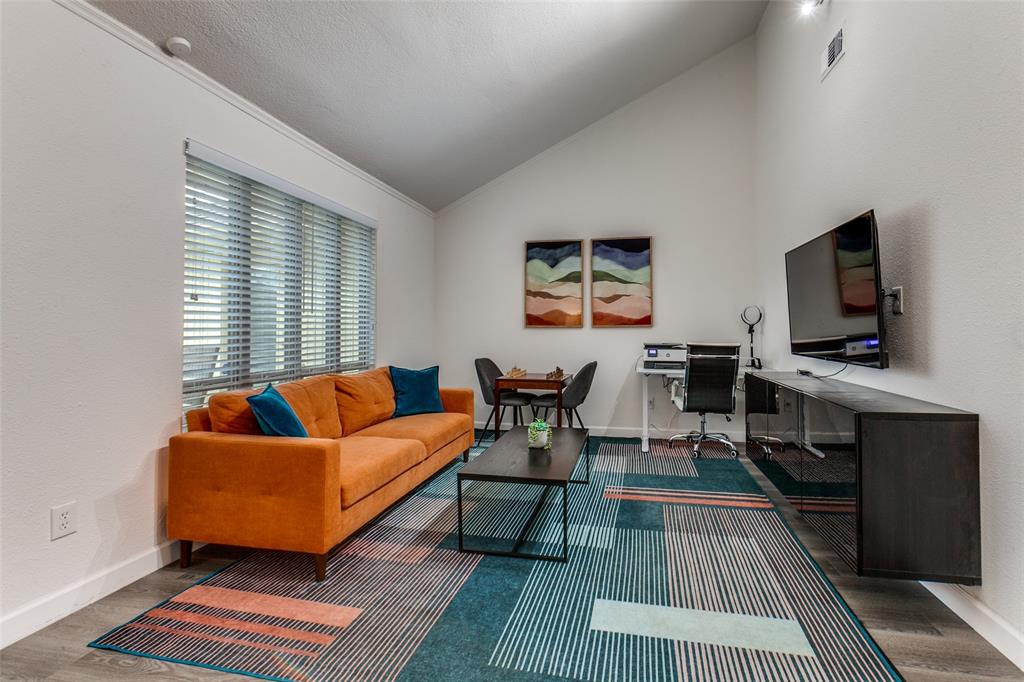 2901 Regal Road Plano, TX 75075 - Photo 13 of 23 a living room with furniture and a flat screen tv