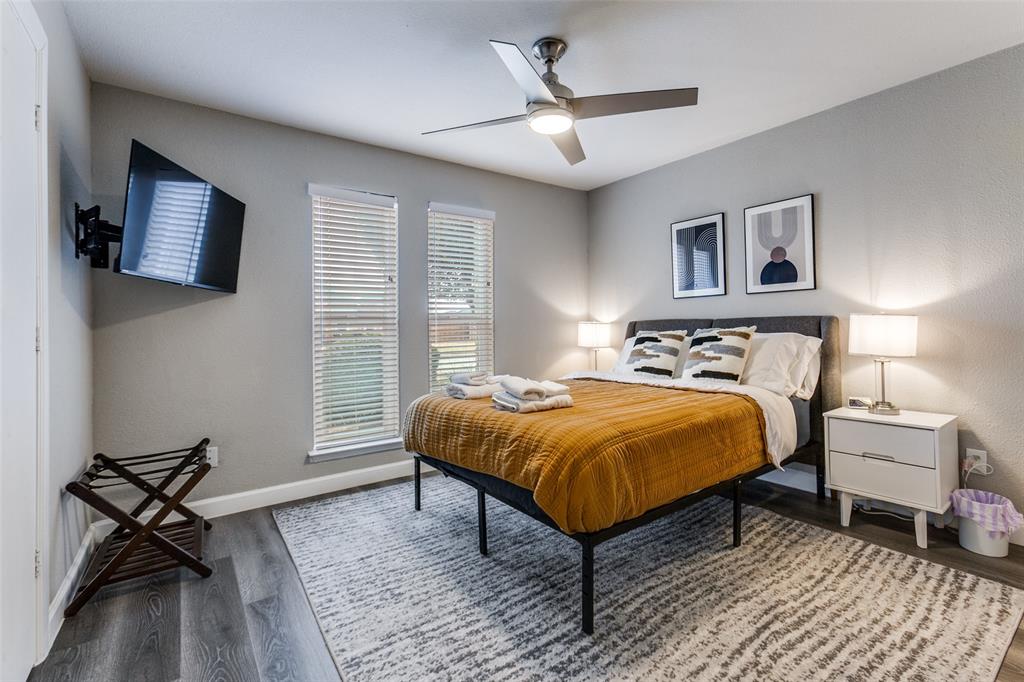 2901 Regal Road Plano, TX 75075 - Photo 17 of 23 a spacious bedroom with a bed and a window
