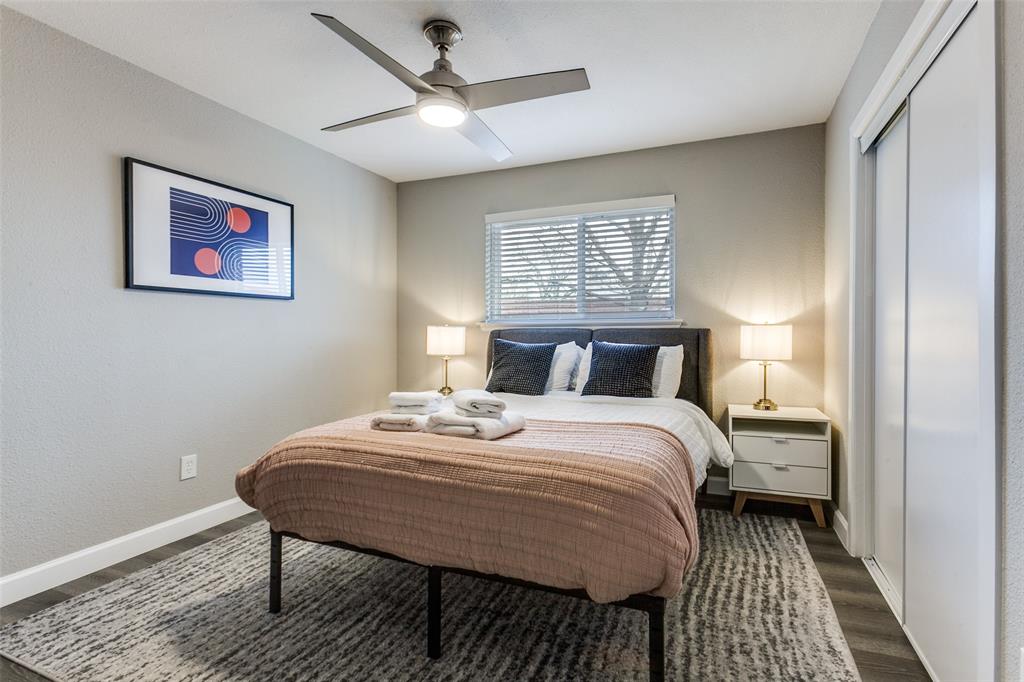 2901 Regal Road Plano, TX 75075 - Photo 17 of 21 a bedroom with a bed and a table