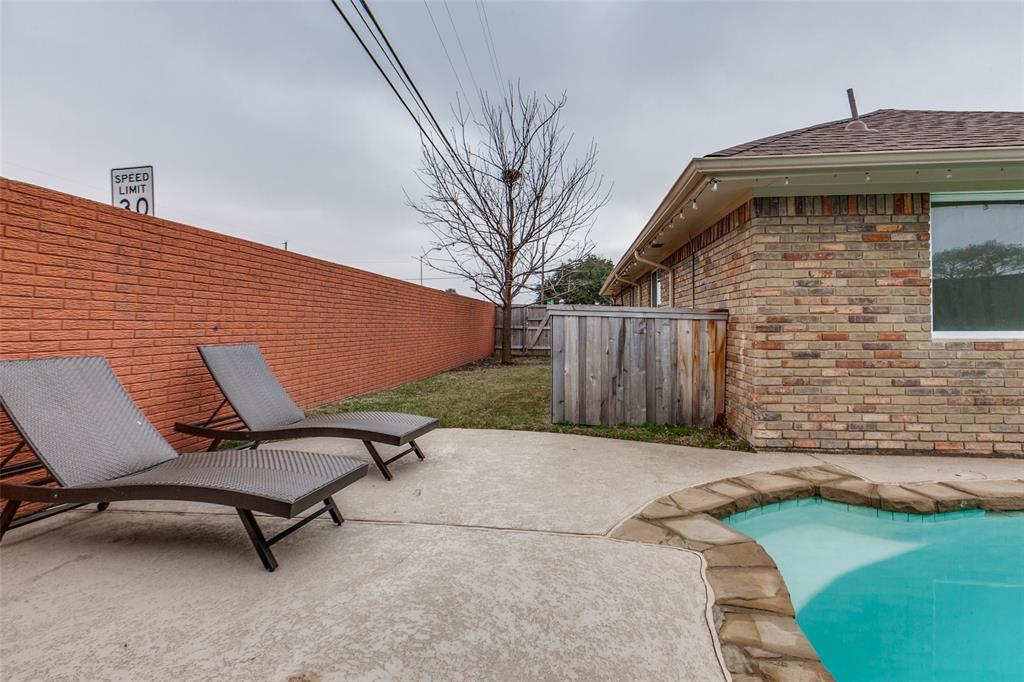 2901 Regal Road Plano, TX 75075 - Photo 20 of 21 a view of a patio with a table and chairs