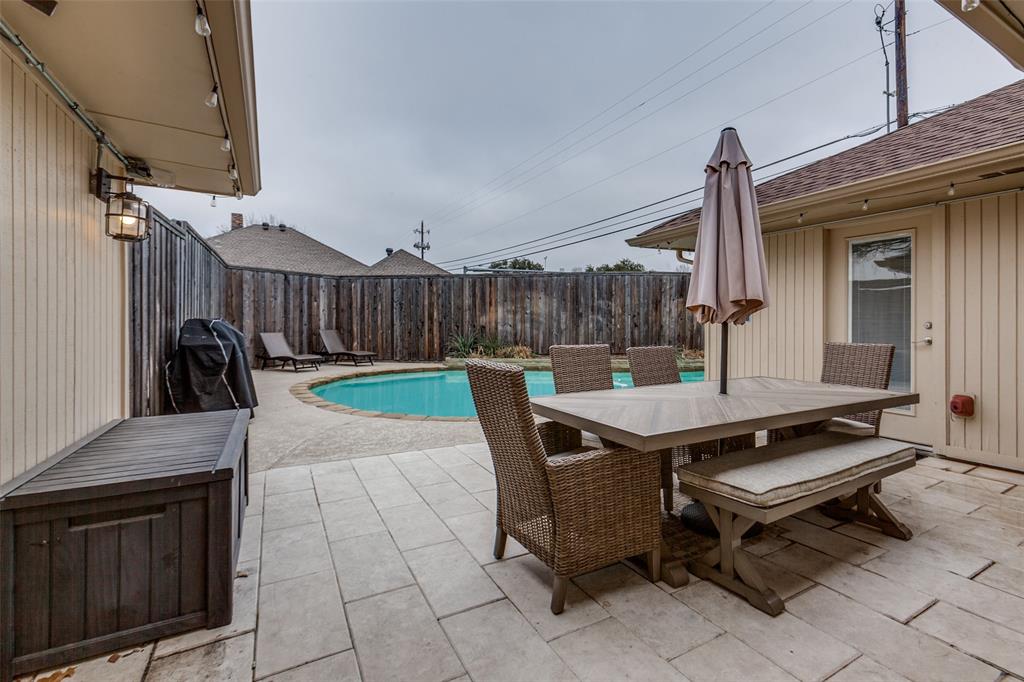 2901 Regal Road Plano, TX 75075 - Photo 21 of 23 a backyard of a house with table and chairs