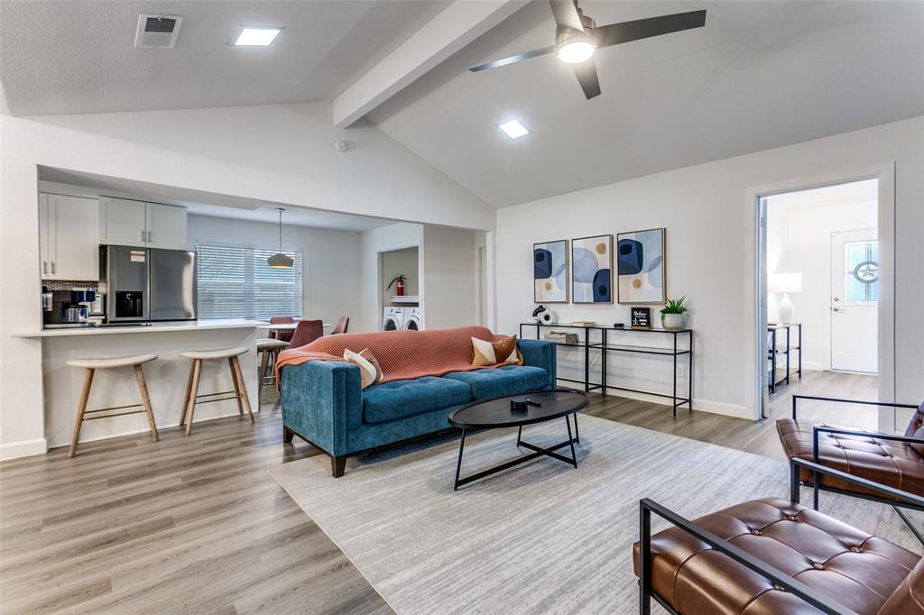 2901 Regal Road Plano, TX 75075 - Photo 5 of 23 a living room with furniture and a wooden floor