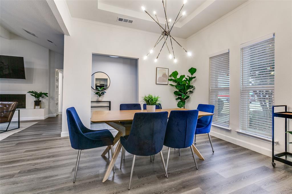 2901 Regal Road Plano, TX 75075 - Photo 6 of 23 a view of a dining room with furniture window and wooden floor