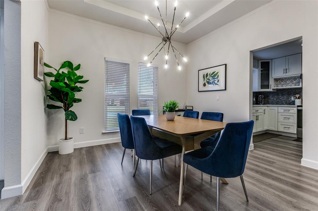 2901 Regal Road Plano, TX 75075 - Photo 7 of 23 a view of a dining room with furniture and wooden floor