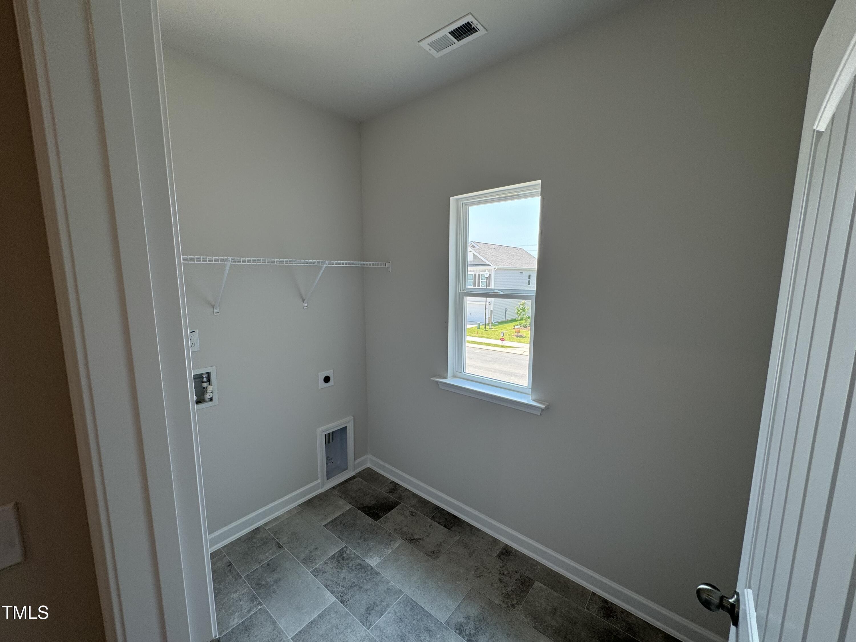 76 Commons Circle Clayton, NC 27520 - Photo 16 of 29 a room that has a window in it