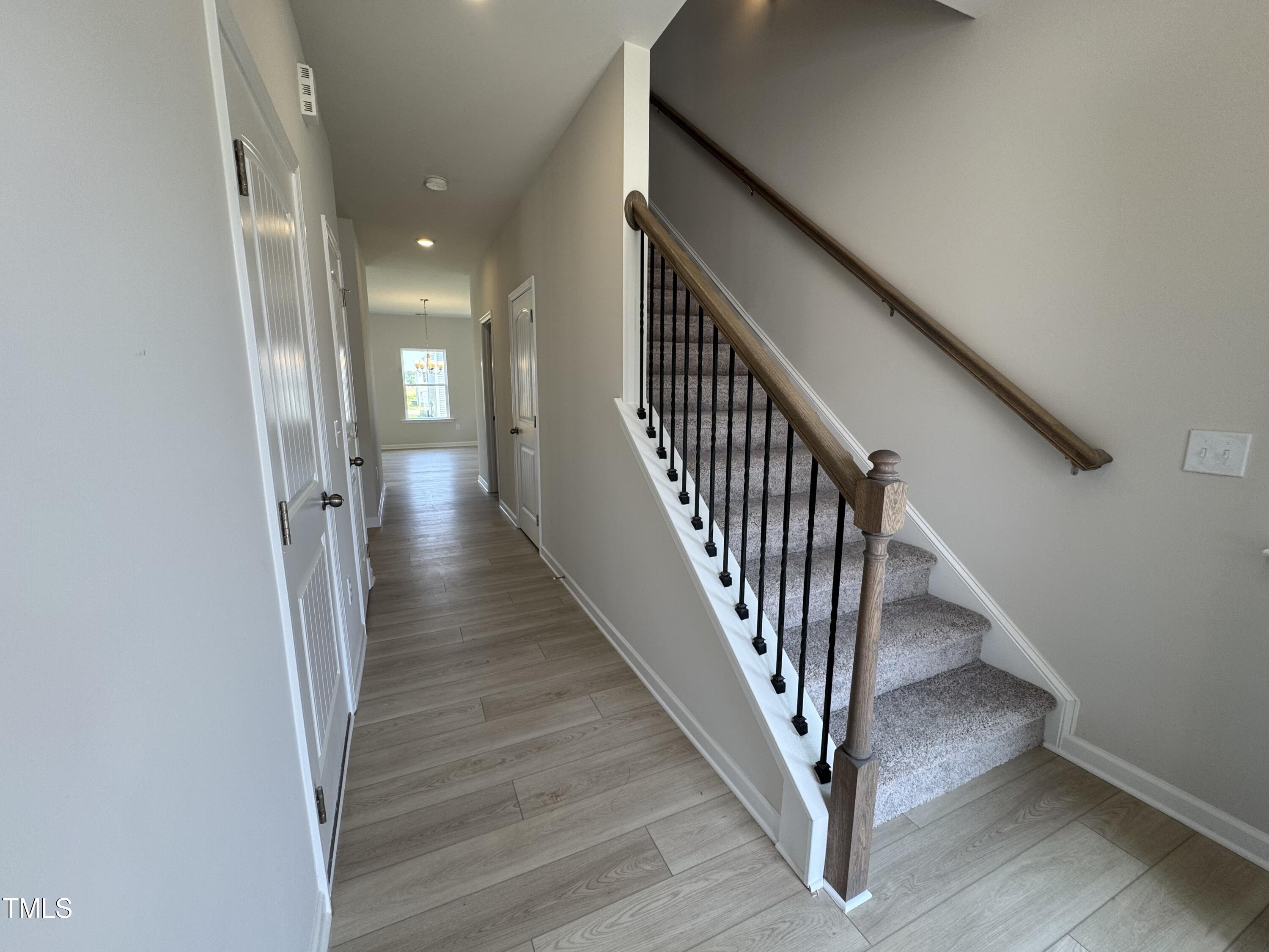 76 Commons Circle Clayton, NC 27520 - Photo 2 of 29 a view of a hallway with staircase