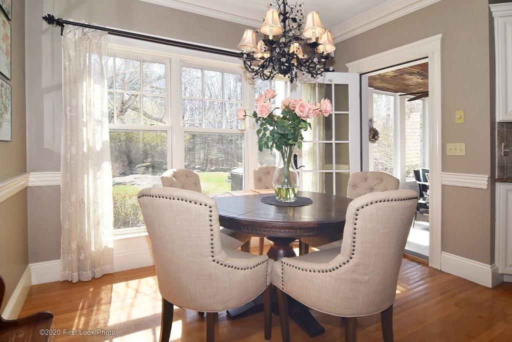 50 Cook Road Cumberland, RI 02864 - Photo 12 of 42 a dining room with furniture window and wooden floor
