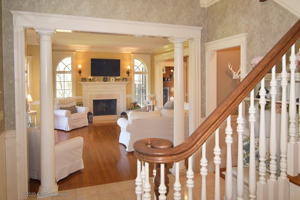 50 Cook Road Cumberland, RI 02864 - Photo 19 of 42 a living room with fireplace furniture and a flat screen tv
