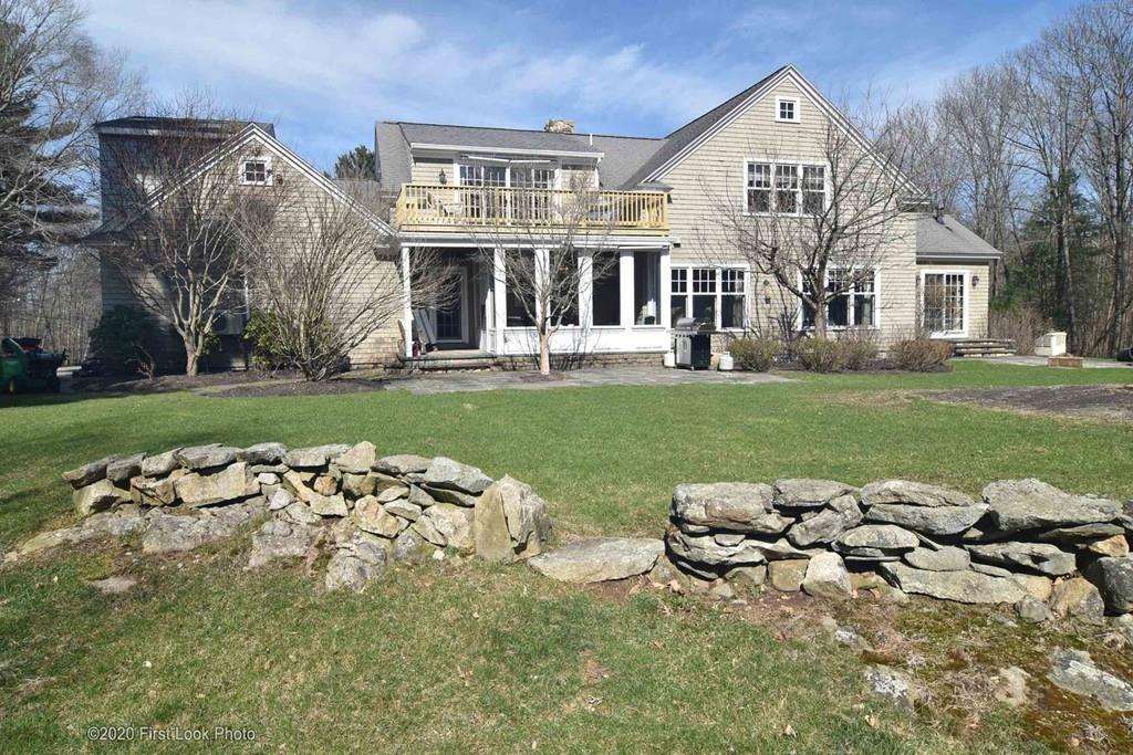 50 Cook Road Cumberland, RI 02864 - Photo 3 of 42 front view of a house with a garden
