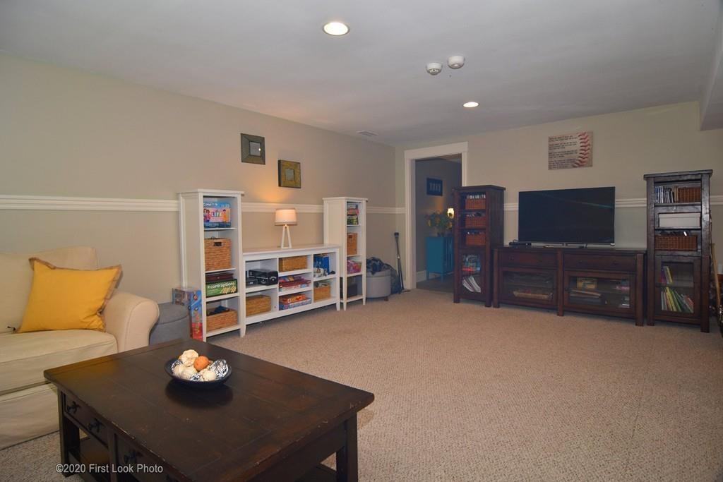 50 Cook Road Cumberland, RI 02864 - Photo 34 of 42 a living room with furniture and a flat screen tv