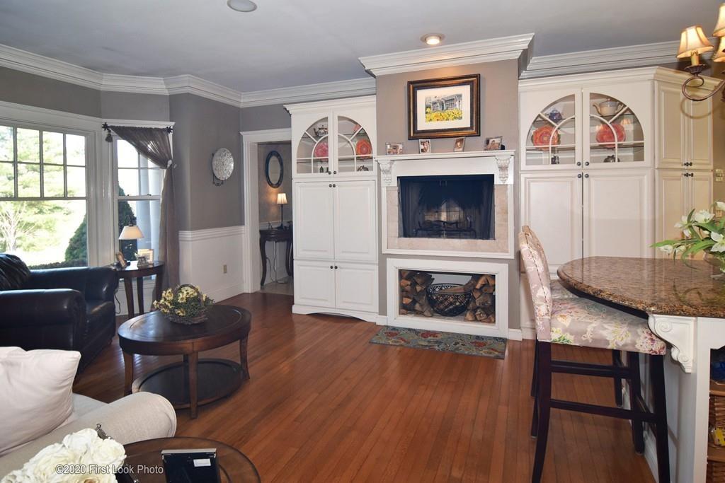 50 Cook Road Cumberland, RI 02864 - Photo 9 of 42 a living room with furniture and a fireplace