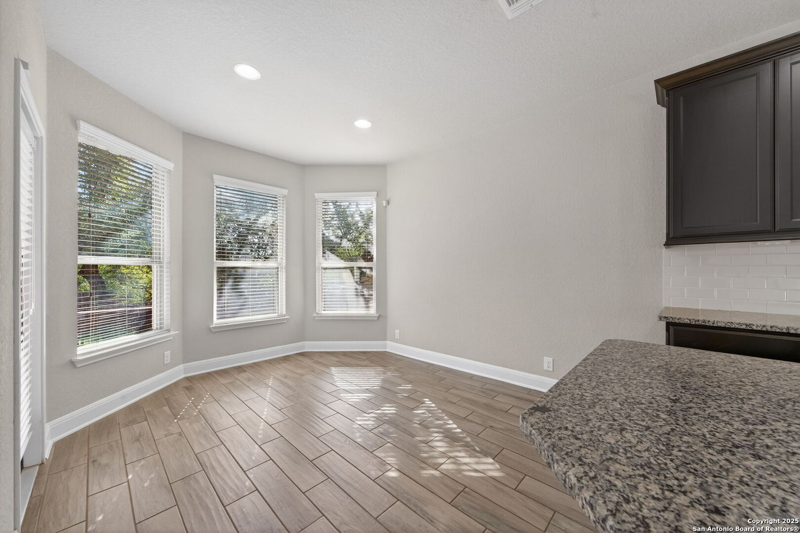 8326 Hydrangea Path Boerne, TX 78015 - Photo 13 of 39 a view of a livingroom with wooden floor and a window