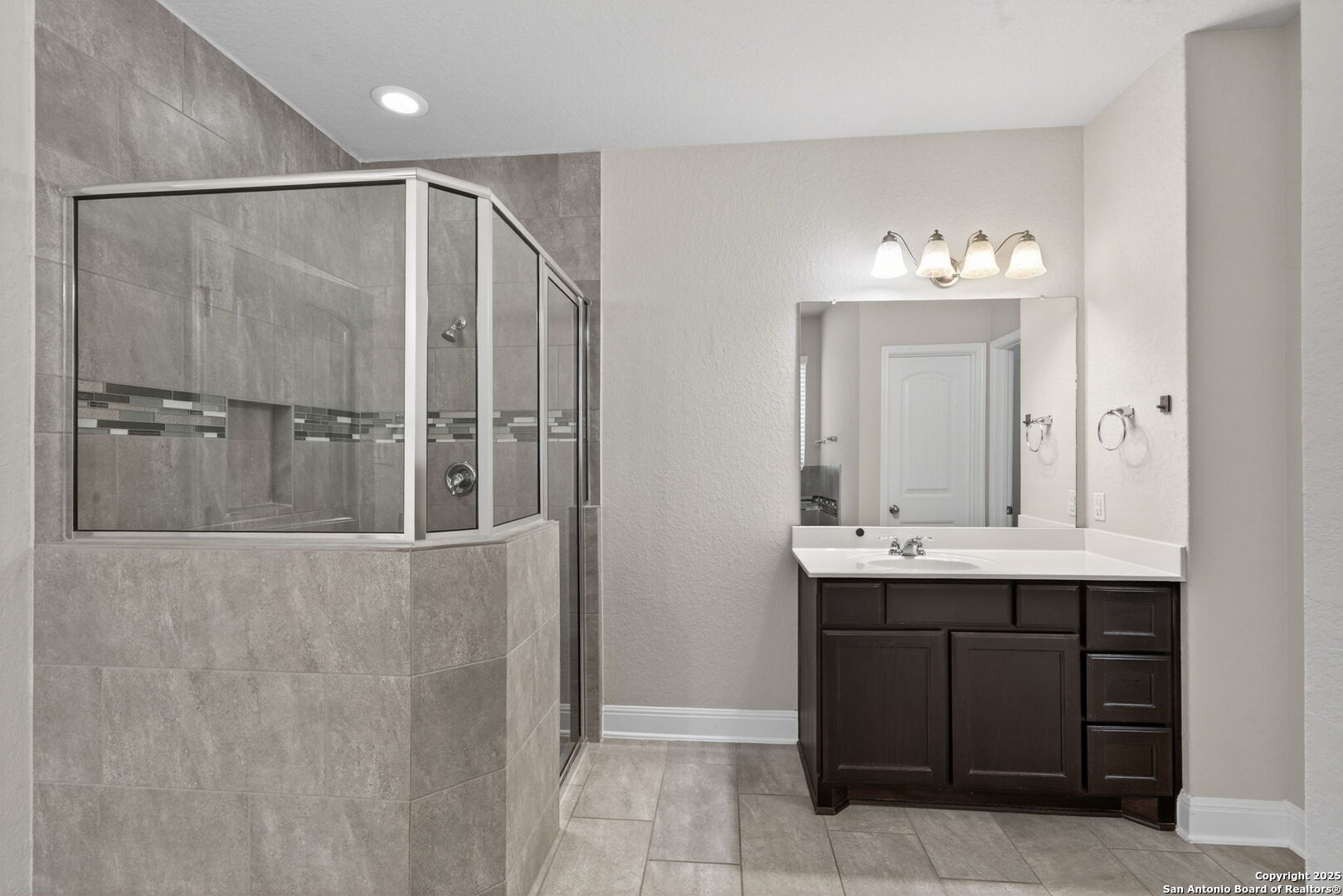 8326 Hydrangea Path Boerne, TX 78015 - Photo 22 of 39 a bathroom with a sink and mirror