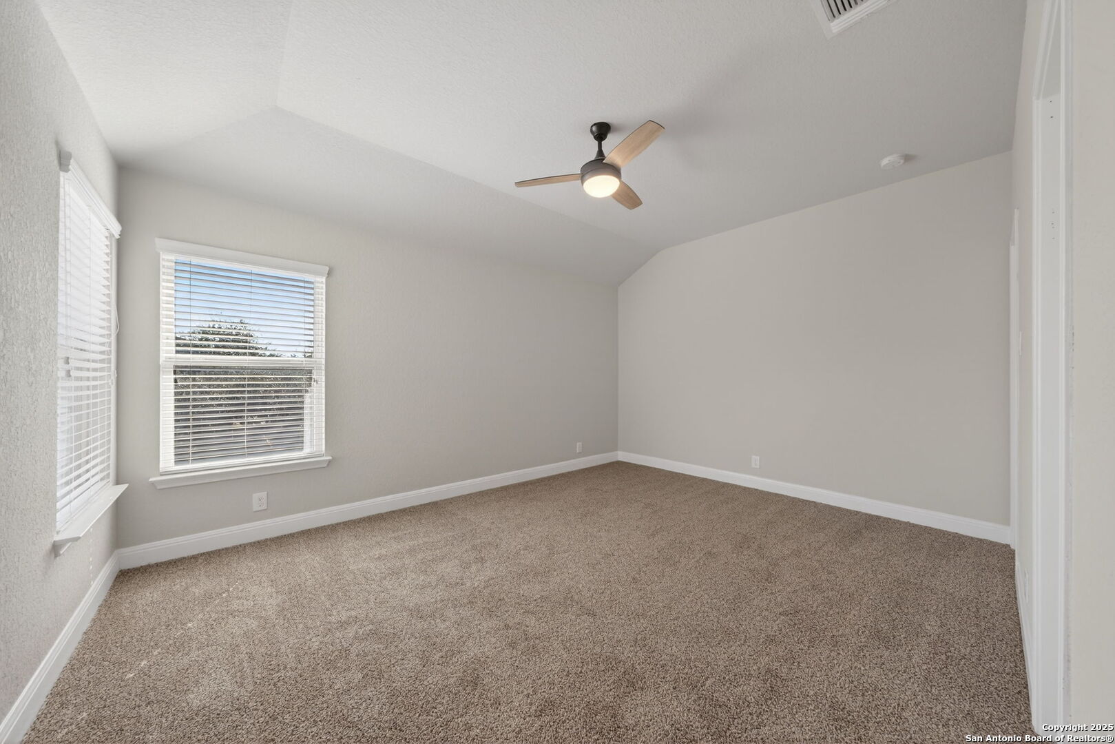 8326 Hydrangea Path Boerne, TX 78015 - Photo 25 of 39 a view of an empty room with a window