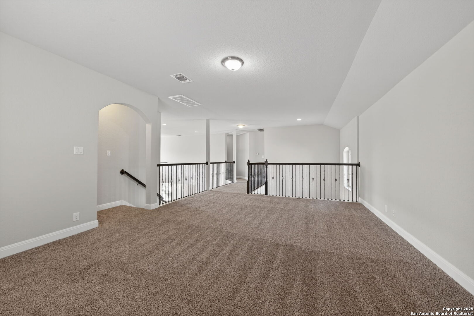 8326 Hydrangea Path Boerne, TX 78015 - Photo 32 of 39 a view of a big room with a chandelier fan and windows